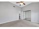 Bedroom with carpet, closet, ceiling fan, light walls, and white trim at 5008 Shoal Creek Cir, Las Vegas, NV 89113