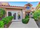 Inviting single-story home with lush landscaping and a red tile roof, offering curb appeal at 5008 Shoal Creek Cir, Las Vegas, NV 89113