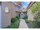 Beautiful single-story home with manicured bushes and a inviting walkway to the front door at 5008 Shoal Creek Cir, Las Vegas, NV 89113