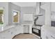 Bright kitchen features white cabinets, stainless steel appliances, light tile flooring, and recessed lighting at 5008 Shoal Creek Cir, Las Vegas, NV 89113