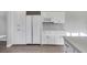 Modern kitchen with updated stainless appliances, light counter tops, and ample cabinet space at 5008 Shoal Creek Cir, Las Vegas, NV 89113