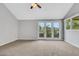 Living room features vaulted ceilings and glass doors to a landscaped backyard at 5008 Shoal Creek Cir, Las Vegas, NV 89113