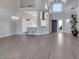 Open concept living space with tile floors, high ceilings, a chandelier, and bright natural light at 5008 Shoal Creek Cir, Las Vegas, NV 89113