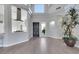 Open-concept floor plan featuring light, modern flooring, high ceilings, and bright natural light at 5008 Shoal Creek Cir, Las Vegas, NV 89113