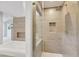Modern glass enclosed shower with built-in niche and rainfall shower head at 5008 Shoal Creek Cir, Las Vegas, NV 89113
