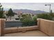 Balcony view of shopping center and mountains at 5052 Whistling Acres Ave, Las Vegas, NV 89131