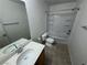 Standard bathroom featuring a single sink vanity, tub and vinyl flooring at 5052 Whistling Acres Ave, Las Vegas, NV 89131