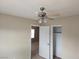 Bright bedroom featuring neutral walls, carpet, ceiling fan, and closet at 5052 Whistling Acres Ave, Las Vegas, NV 89131