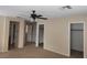 Bedroom featuring neutral walls, carpeted floors, ceiling fan, and closet space at 5052 Whistling Acres Ave, Las Vegas, NV 89131