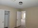 Neutral bedroom with carpeted floor, open closet and doorway visible at 5052 Whistling Acres Ave, Las Vegas, NV 89131