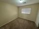 Standard-size bedroom with a window bringing in natural light at 5052 Whistling Acres Ave, Las Vegas, NV 89131