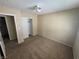 Standard-size bedroom with a ceiling fan and closet at 5052 Whistling Acres Ave, Las Vegas, NV 89131