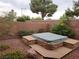Above ground hot tub feature in the backyard with mature landscaping, gravel, and a block wall at 5052 Whistling Acres Ave, Las Vegas, NV 89131