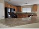 Kitchen featuring granite countertops, stainless steel appliances, and ample cabinet space at 5052 Whistling Acres Ave, Las Vegas, NV 89131