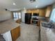 Updated kitchen featuring granite counters, stainless steel appliances, and ample cabinet space at 5052 Whistling Acres Ave, Las Vegas, NV 89131