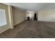 Spacious room with plush carpet, neutral walls, and abundant natural light at 5052 Whistling Acres Ave, Las Vegas, NV 89131