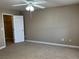 Comfortable bedroom with a neutral color scheme, closet and ceiling fan with light at 5055 W Hacienda Ave # 2102, Las Vegas, NV 89118