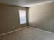 Cozy bedroom featuring carpet, a window for natural light, and neutral walls at 5055 W Hacienda Ave # 2102, Las Vegas, NV 89118