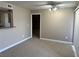 Inviting living room with neutral walls, carpeted floor and a view through to the kitchen at 5055 W Hacienda Ave # 2102, Las Vegas, NV 89118