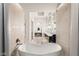 Spa-like bathroom featuring a soaking tub and dual vanity sinks, designed for relaxation and comfort at 515 Serenity Point Dr, Henderson, NV 89012