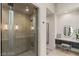 Bright bathroom featuring glass enclosed shower and vanity with illuminated mirror at 515 Serenity Point Dr, Henderson, NV 89012