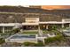 Luxury home exterior with a modern pool, outdoor living areas, and stunning hillside backdrop at 515 Serenity Point Dr, Henderson, NV 89012