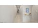 Bright hallway with neutral tones, streamlined doors, and modern accents leading to other areas of the home at 515 Serenity Point Dr, Henderson, NV 89012