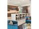 Modern kitchen with an oversized island, stylish bar stools, and a built-in bar for luxurious living at 515 Serenity Point Dr, Henderson, NV 89012