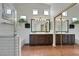 Bathroom with double sinks, tiled shower, garden tub and tiled floor at 520 Blackbird Knoll Ct, North Las Vegas, NV 89084