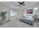 Bright bedroom with a ceiling fan, large window and neutral decor at 520 Blackbird Knoll Ct, North Las Vegas, NV 89084