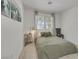 Cozy bedroom featuring a comfortable bed and a window with natural light at 520 Blackbird Knoll Ct, North Las Vegas, NV 89084
