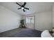 Bright bedroom with a ceiling fan, large window and neutral decor at 520 Blackbird Knoll Ct, North Las Vegas, NV 89084