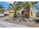Inviting single-story home featuring palm trees, a two-car garage, and low-maintenance desert landscaping at 520 Blackbird Knoll Ct, North Las Vegas, NV 89084