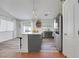 Bright kitchen featuring gray cabinets, quartz countertops, stainless steel appliances, and stylish pendant lighting at 520 Blackbird Knoll Ct, North Las Vegas, NV 89084