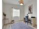 Cozy office space with a desk, stylish chair, and decorative accents at 520 Blackbird Knoll Ct, North Las Vegas, NV 89084
