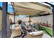 Comfortable outdoor seating beneath a shaded pergola, perfect for entertaining at 520 Blackbird Knoll Ct, North Las Vegas, NV 89084