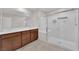Bathroom featuring double vanity, framed mirror, and spacious glass shower at 5503 Jinan St, Las Vegas, NV 89148
