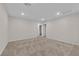 A bedroom with light walls and carpet leading to a doorway at 5503 Jinan St, Las Vegas, NV 89148