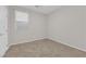 Neutral bedroom with tile flooring and large window providing natural light at 5503 Jinan St, Las Vegas, NV 89148