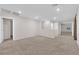 Large bedroom area with neutral walls, carpets, and bright lighting at 5503 Jinan St, Las Vegas, NV 89148