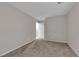 A light and bright bedroom with neutral walls and carpeting at 5503 Jinan St, Las Vegas, NV 89148