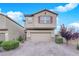 Charming two-story home featuring desert landscaping and a two-car garage at 5503 Jinan St, Las Vegas, NV 89148