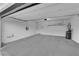 Spacious garage with painted floor, water heater, and overhead storage at 5503 Jinan St, Las Vegas, NV 89148