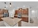 Modern kitchen featuring granite countertops, stainless steel appliances, and a center island at 5503 Jinan St, Las Vegas, NV 89148