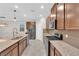 Modern kitchen featuring granite countertops, stainless steel appliances, and ample cabinet space at 5503 Jinan St, Las Vegas, NV 89148