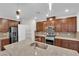 Well-equipped kitchen boasts granite countertops, stainless steel appliances, a kitchen island and stylish lighting at 5503 Jinan St, Las Vegas, NV 89148