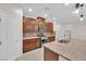 Bright kitchen showcasing granite countertops, tile flooring, stainless appliances, and stylish cabinetry at 5503 Jinan St, Las Vegas, NV 89148