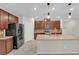 Spacious kitchen with a large island, granite countertops, stainless steel appliances, and ample storage at 5503 Jinan St, Las Vegas, NV 89148