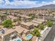 Expansive aerial view of a neighborhood with houses and swimming pools at 5528 Stone Lagoon St, North Las Vegas, NV 89031
