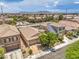 Aerial shot of homes with solar panels, complemented by a neighborhood swimming pool at 5528 Stone Lagoon St, North Las Vegas, NV 89031